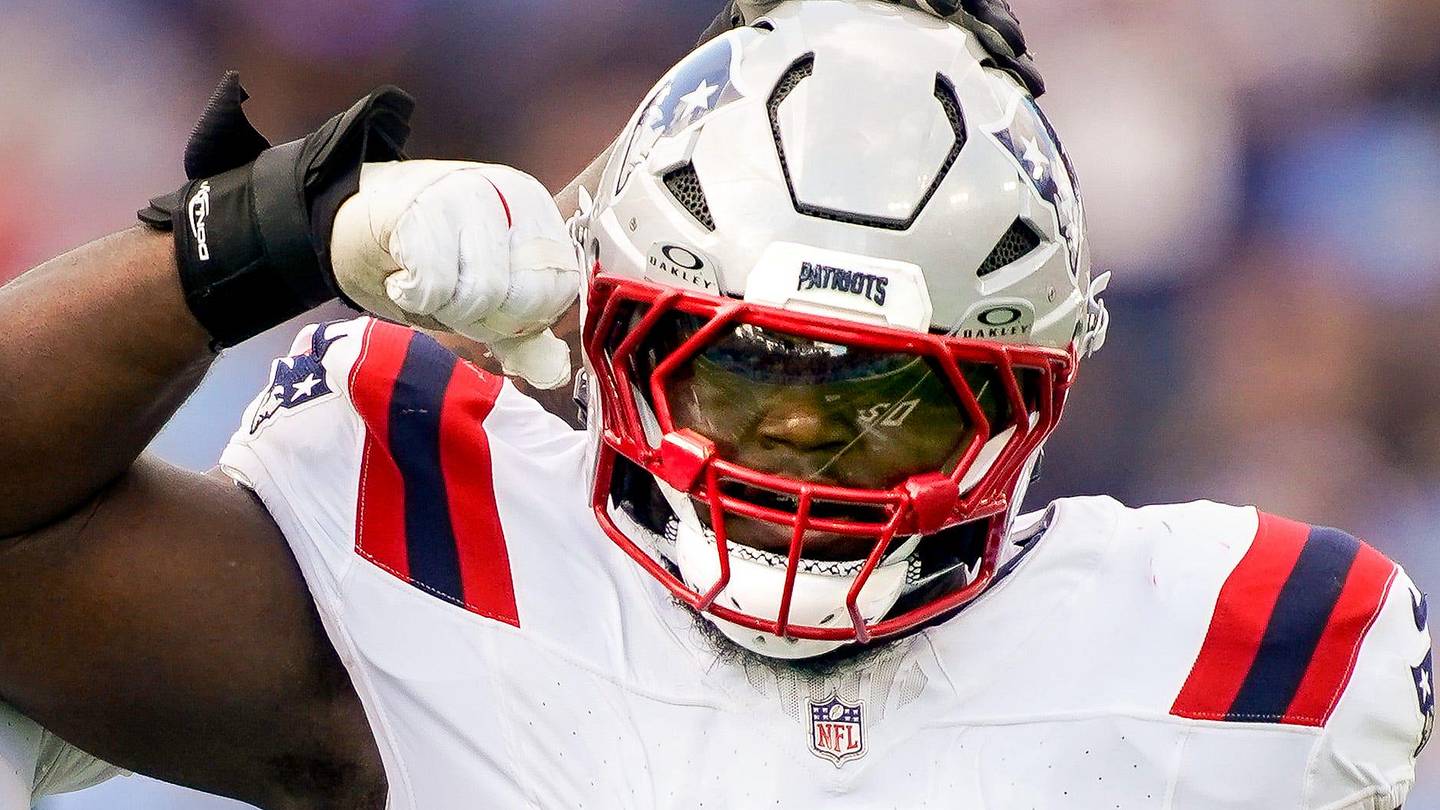 New England Patriots defensive end Milton Williams (97) celebrates sacking Tennessee Titans quarterback Cam Ward (1) during the third quarter at Nissan Stadium in Nashville, Tenn., Sunday, Oct. 19, 2025.
