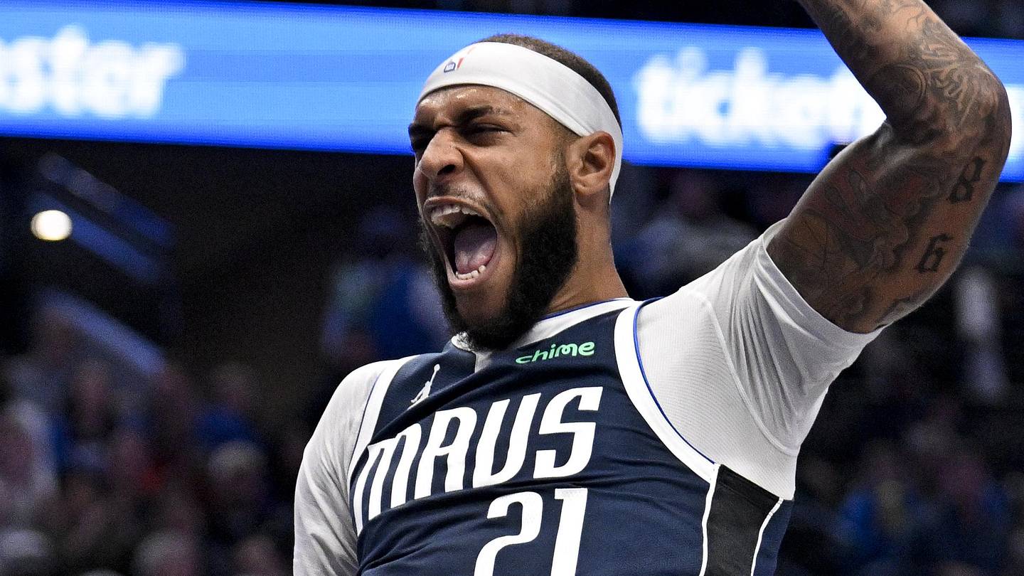 Dec 18, 2025; Dallas, Texas, USA; Dallas Mavericks forward Daniel Gafford (21) reacts after he dunks the ball against the Detroit Pistons during the second quarter at the American Airlines Center. Mandatory Credit: Jerome Miron-Imagn Images