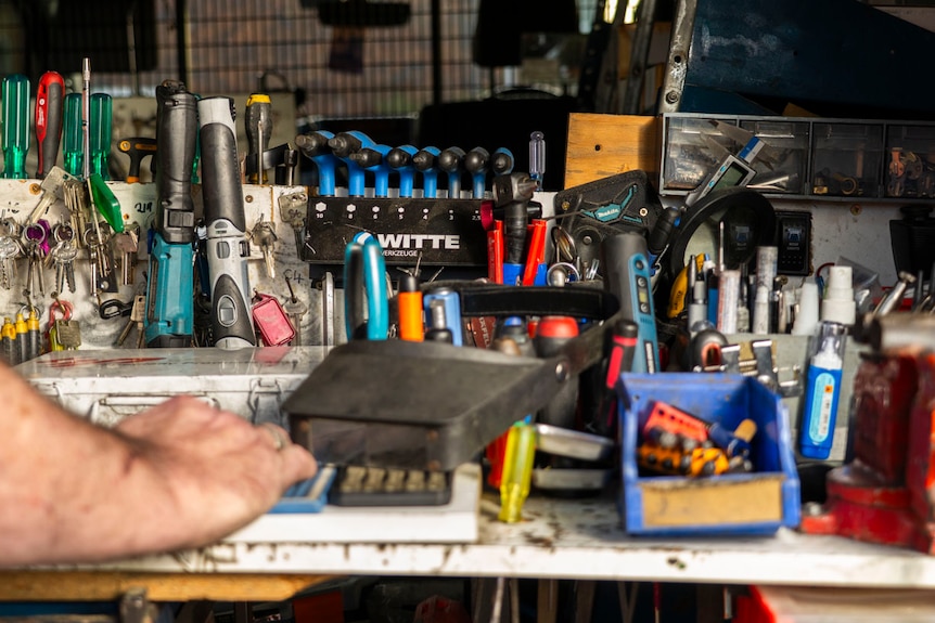 a board of keys and tools hanging in a locksmith van