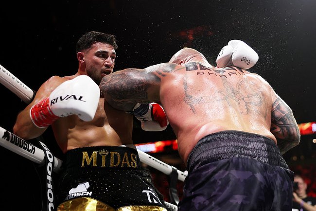 Tommy Fury punches Eddie Hall during the Beauty versus The Beast fight night