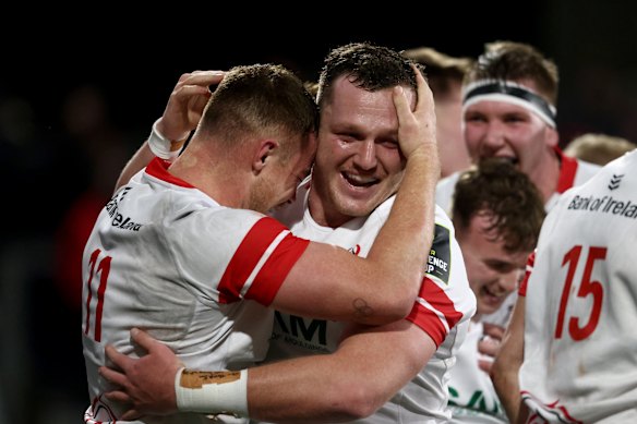 Angus Bell celebrates with Ulster teammates.