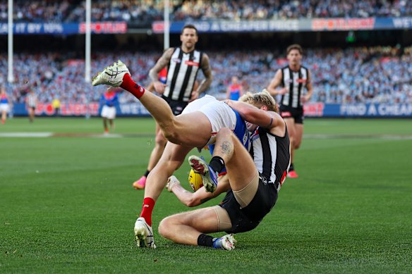 Brody Mihocek was caught in a tackle by former teammate Billy Frampton.