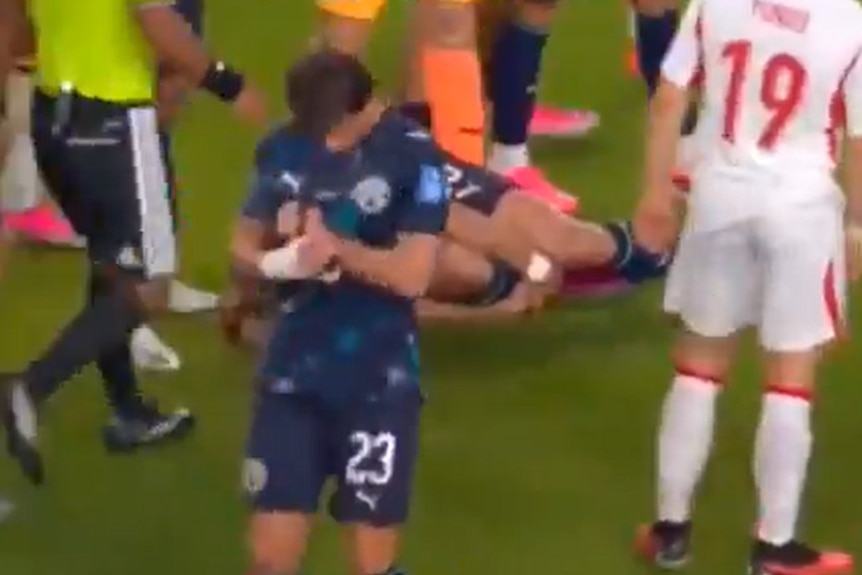 Paraguay's Matias Galarza puts on the referee's watch during a game.