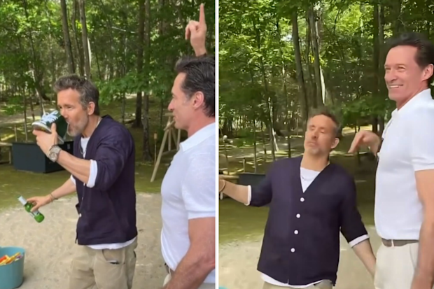 Ryan Reynolds falls after doing a shoey with Hugh Jackman
