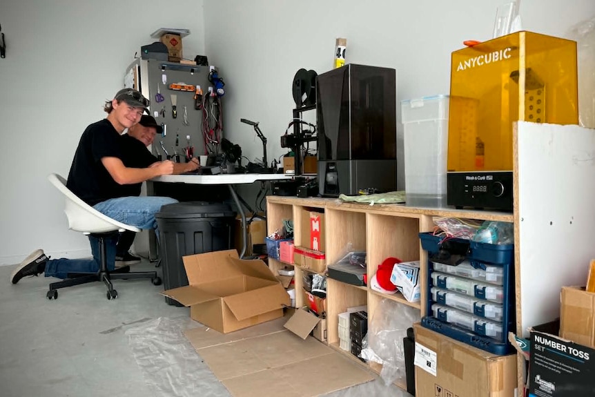 Two men at workbench