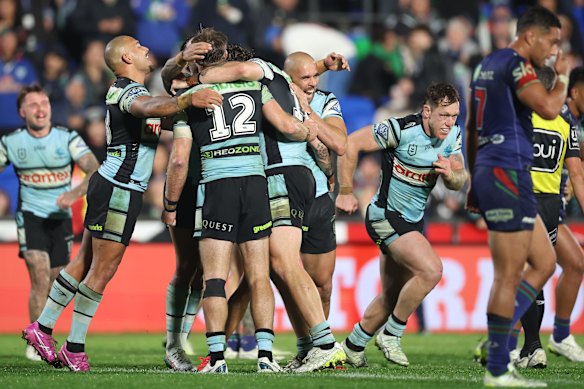 The Sharks celebrate their late winner against the Warriors.