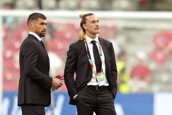 Mat Ryan and Jackson Irvine wear suits