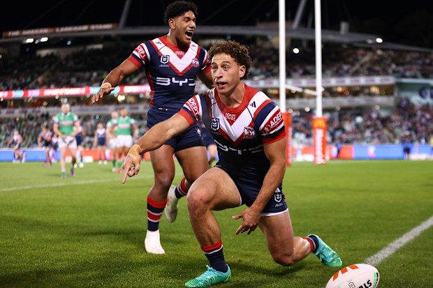 Mark Nawaqanitawase of the Roosters celebrates scoring a try.
