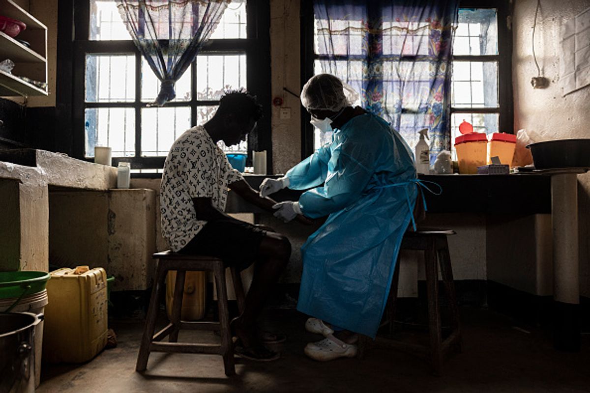 MONGBWALU, DEMOCRATIC REPUBLIC OF CONGO - MAY 20: A patient prepares to have blood drawn for a test at General Referral Hospital of Mongbwalu during the Ebola outbreak response in the Democratic Republic of Congo