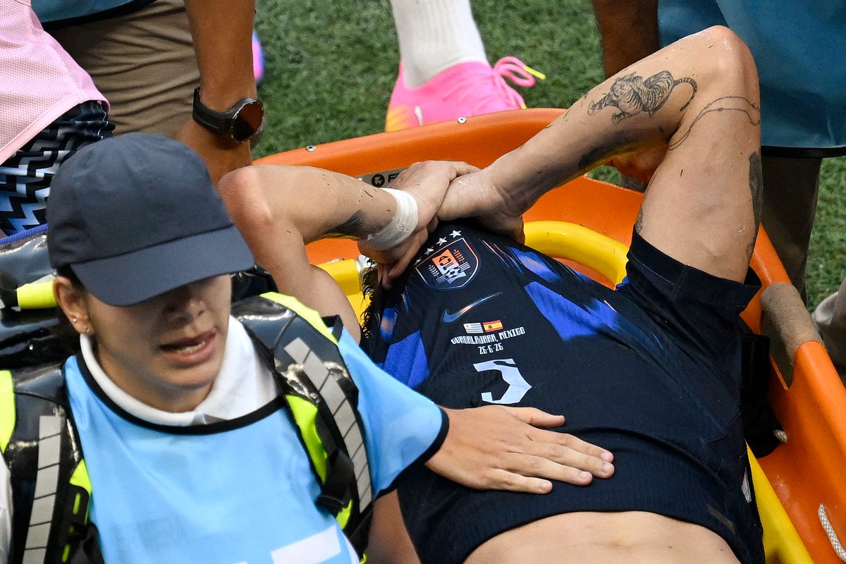 Uruguay's midfielder #05 Manuel Ugarte leaves the pitch after being injured during the 2026 World Cup Group H football match between Uruguay and Spain at the Guadalajara Stadium in Zapopan on June 26, 2026.  (Photo by Alfredo ESTRELLA/AFP via Getty Images)
