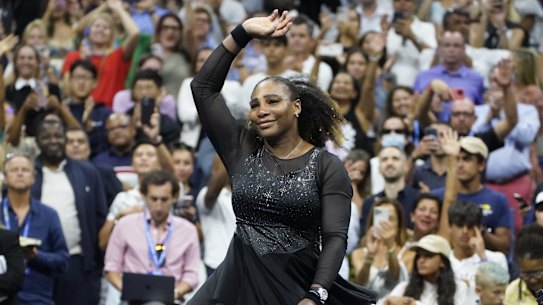 Serena Williams, of the United States, spins as she waves to fans after losing to Ajla Tomljanovic, of Austrailia, in the third round of the US Open in 2022.