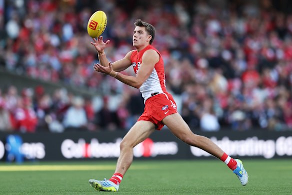 Jai Serong of the Swans marks the ball 