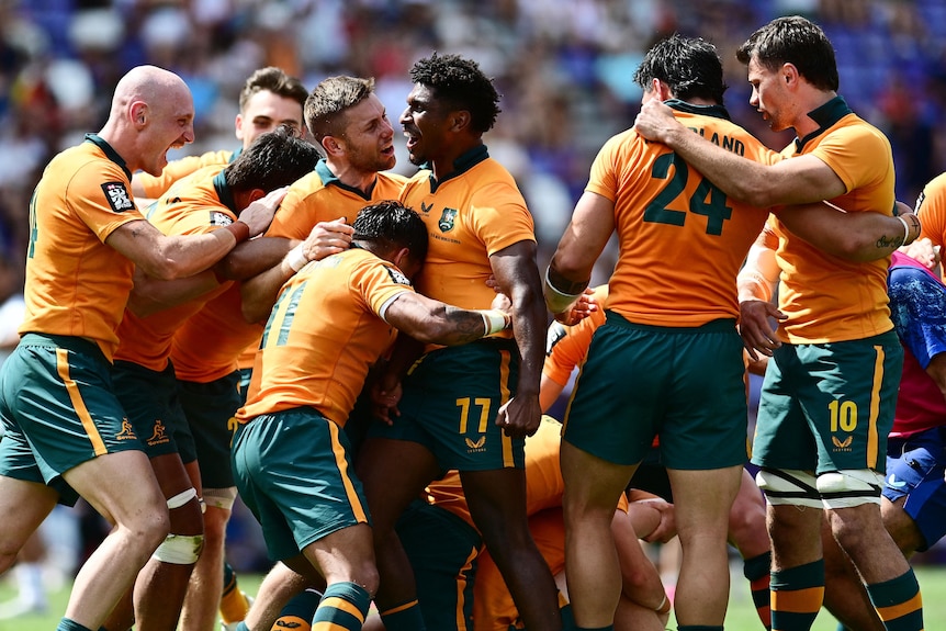 Australia celebrates defeating South Africa in the men's final at the rugby sevens World Championship leg in Spain.