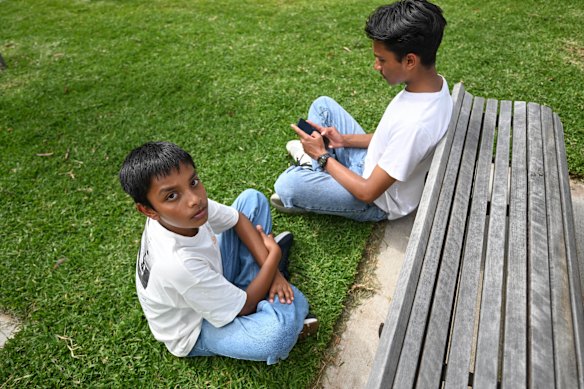Rehan Rahman (facing camera), 13, and his older brother Taihan.