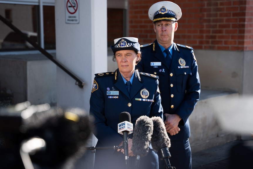 Police Commissioner Donna Adams stands in front of microphones and looks at media doorstop