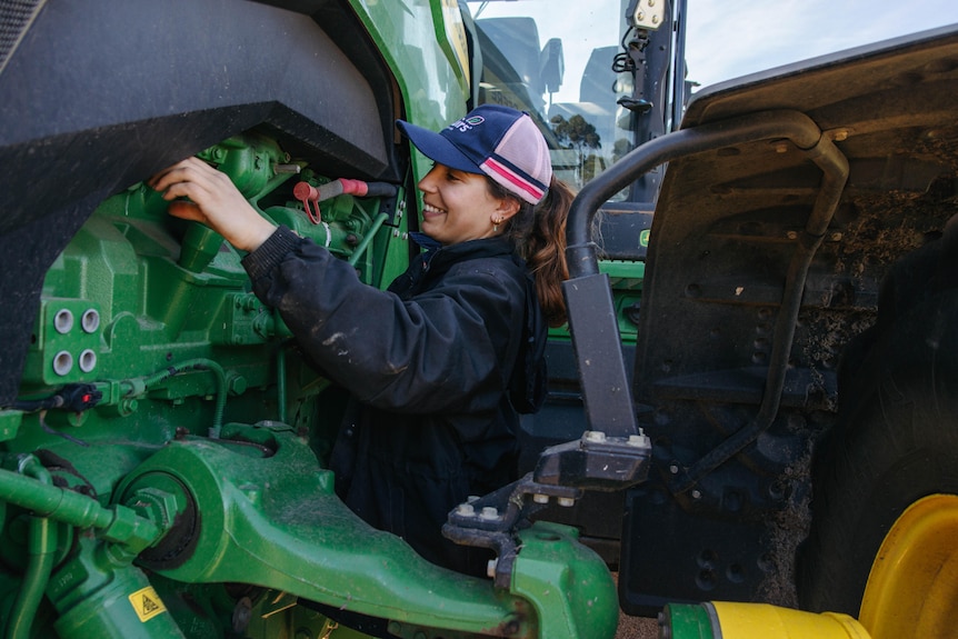 a female fixing a truck