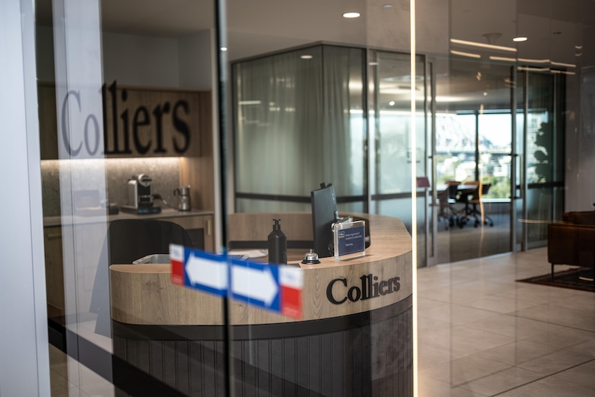 Looking through the windows of a Colliers office.