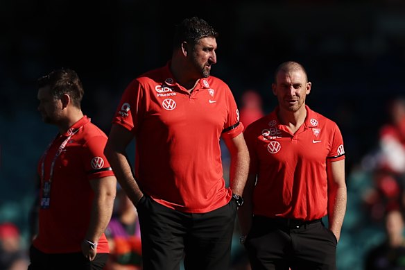 Swans coach Dean Cox speaks with Goodwin on match day recently.