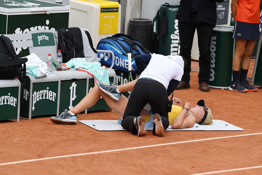 Clara Tauson receives treatment during her first round clash in the French Open