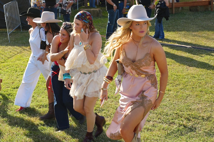 Young women at a country music festival.