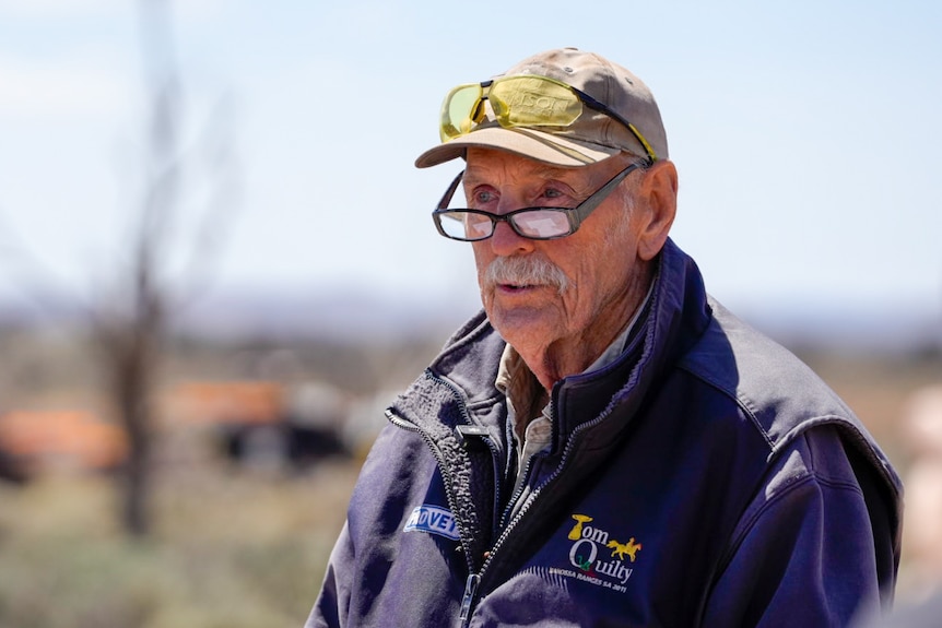 A man in a cap and glasses.