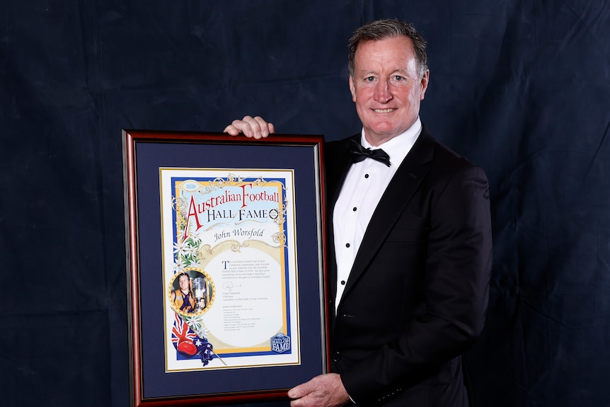 John Worsfold poses with his Australian Football Hall of Fame inductee certificate.