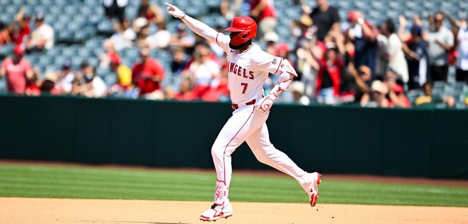 Jo Adell circles the bases after hitting a home run.