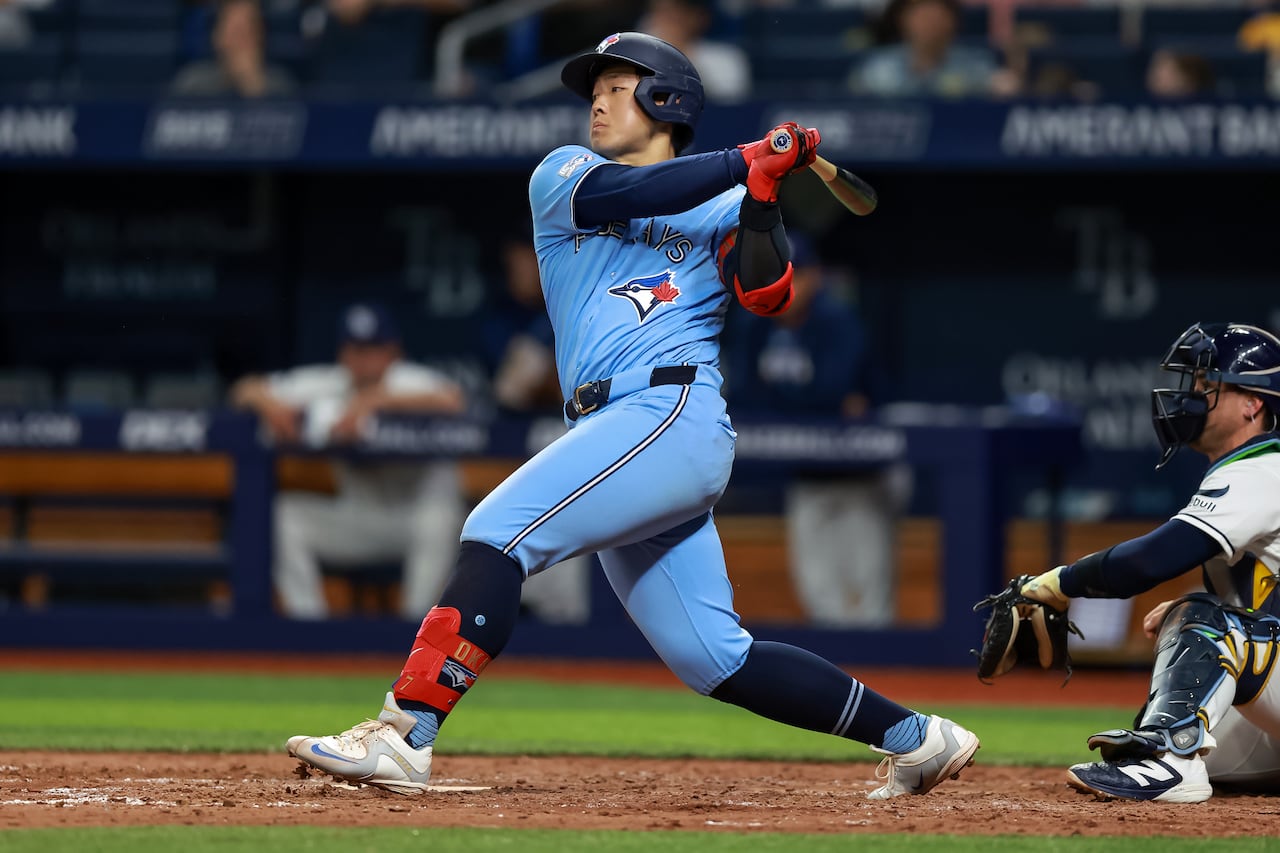 Blue Jays infielder Kazuma Okamoto, is seen in the follow-through of his swing, after hitting a single during a May 5, 2026, game against the Tampa Bay Rays.