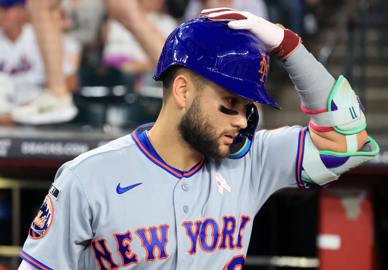 New York Mets infielder Bo Bichette, seen adjusting his batting helmet, during a May 10, 2026 game against the Arizona Diamondbacks.