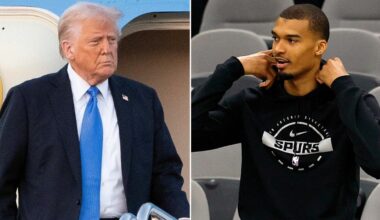 President Donald Trump reacts to Spurs star Victor Wembanyama folding his arms during the anthem
