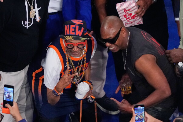 Filmmaker Spike Lee, left, and comedian Dave Chappelle, arrive prior to Game 3 of the NBA Finals basketball series between the San Antonio Spurs and the New York Knicks, Monday, June 8, 2026, in New York. (AP Photo/Yuki Iwamura)