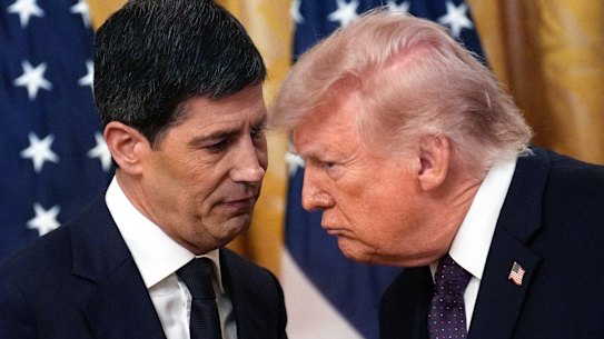 Warsh and US President Donald Trump confer following their speeches.