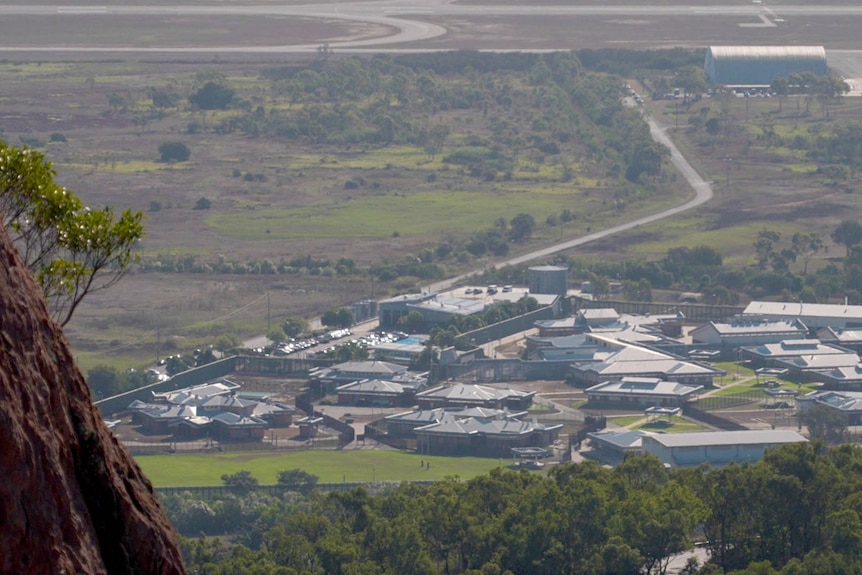 Looking down from a hill to the rooves of numerous buildings that make up Cleveland detention centre