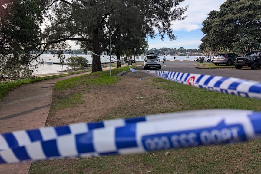 Blue police tape at Bayview Park on Burwood Road, Concord.