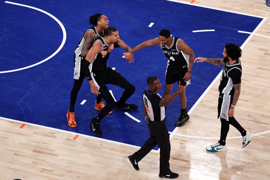 Jun 10, 2026; New York, New York, USA; San Antonio Spurs forward Victor Wembanyama (1) reacts with teammates against the New York Knicks during game four of the 2026 NBA Finals in the first quarter at Madison Square Garden.