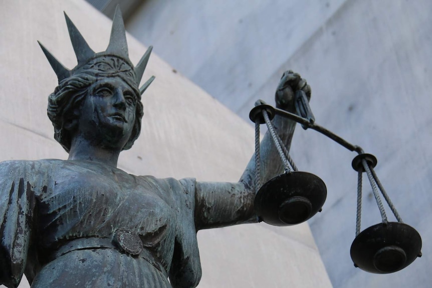 Lady Justice statue outside Brisbane court.