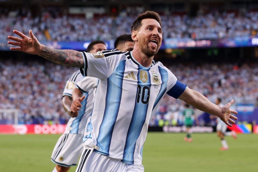 Lionel Messi holds his hands out wide