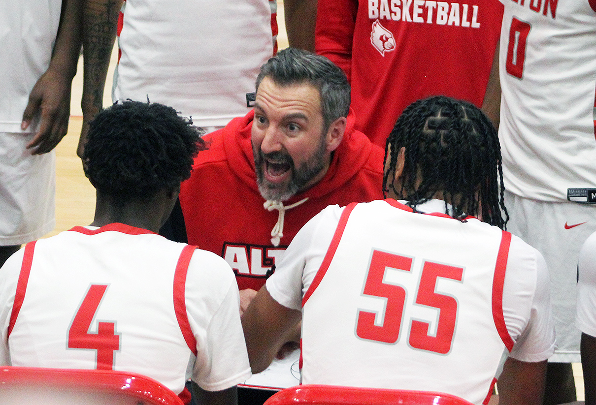 Alton boys basketball coach Dylan Dudley reacts during a timeout last season at AHS. Dudley is happy with the IHSA giving final approval to begin use of a 35-second shot clock for varsity boys and girls games beginning with the upcoming 2026-27 season. 