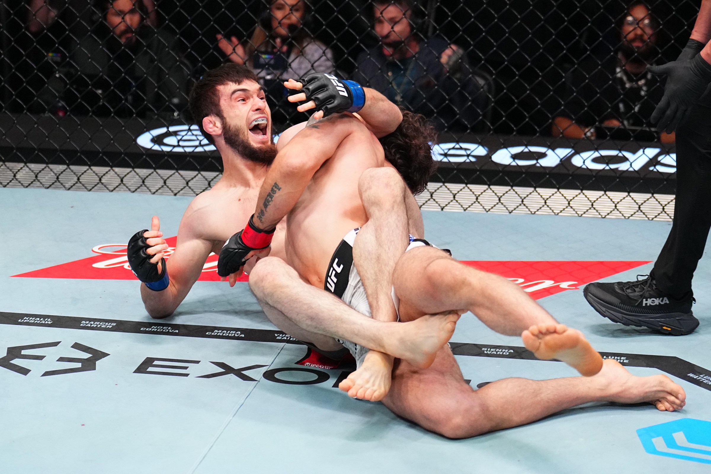 LAS VEGAS, NEVADA - JUNE 20: Murtazali Magomedov of Kyrgyzstan secures a submission against Melsik Baghdasaryan of Armenia in a featherweight fight during the UFC Fight Night event at Meta APEX on June 20, 2026 in Las Vegas, Nevada. (Photo by Chris Unger/Zuffa LLC)