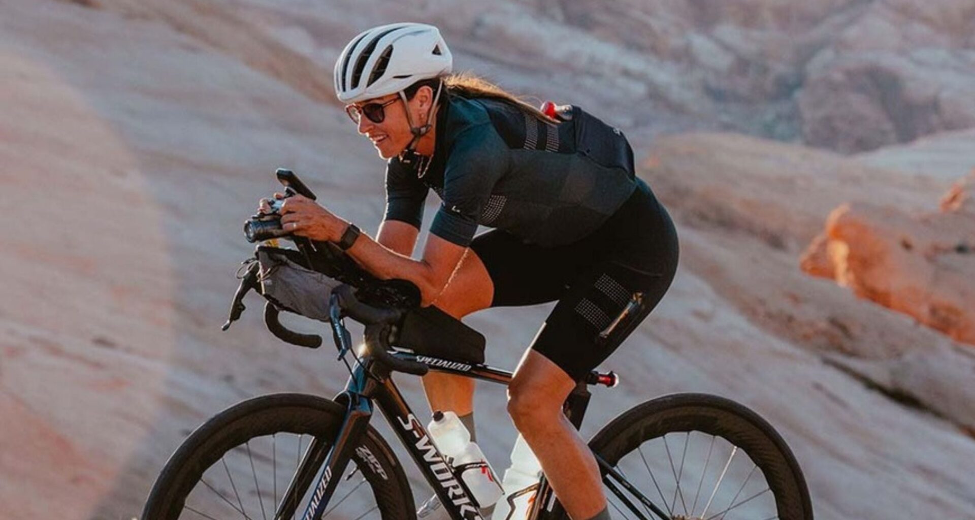 Lael Wilcox riding a bike for her around the world record attempt