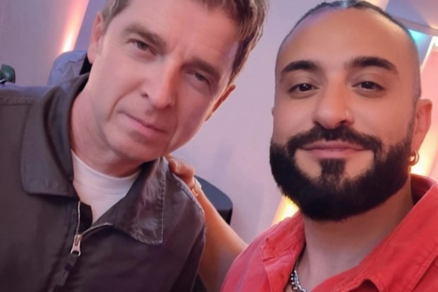 Kris Fade is pictured with Noel Gallagher of Oasis.