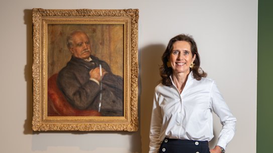 Claire Durand-Ruel pictured with a portrait of Paul Durand-Ruel by Auguste Renoir