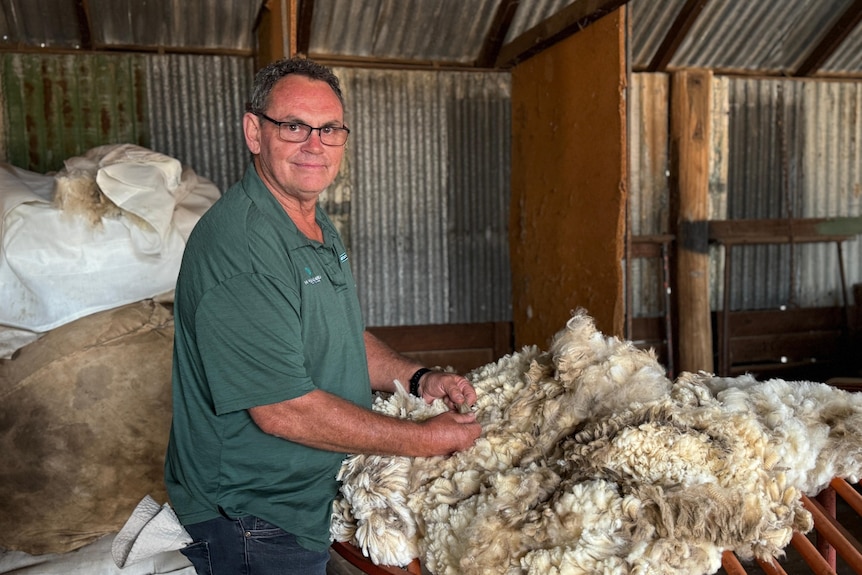 man standing with wool