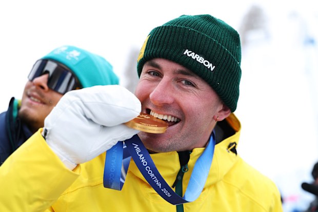 Gold medalist Cooper Woods of Australia celebrates on the podium.