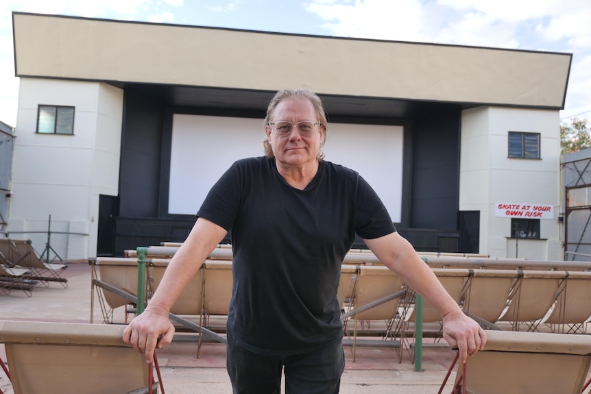 man standing in outdoor cinema in winton