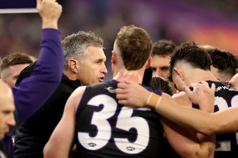 Justin Longmuir addresses his team. 