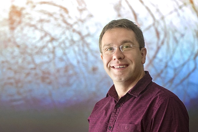Man in glasses smiling
