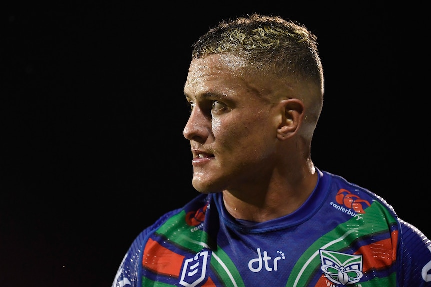 A man looks on during a rugby league match