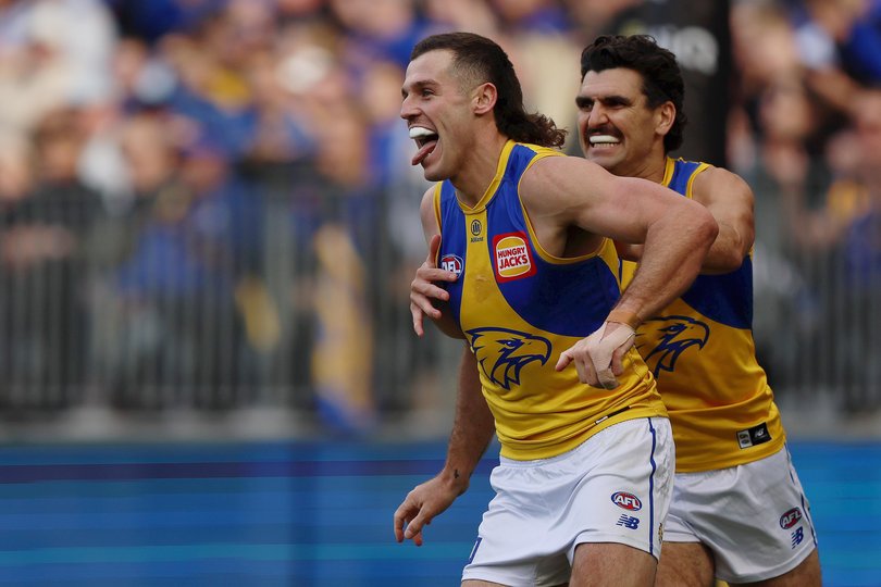Jake Waterman celebrates a goal against North Melbourne with Tom Cole. 