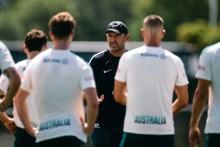 Tony Popovic addresses the Socceroos squad during a training session